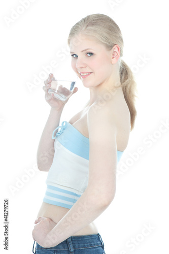 beautiful teenage girl with glass of water over white