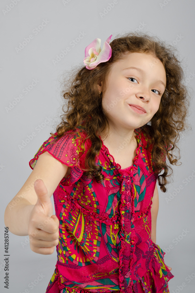 Portrait of smiling little girl with thumb up Portrait of smiling little girl with thumb up