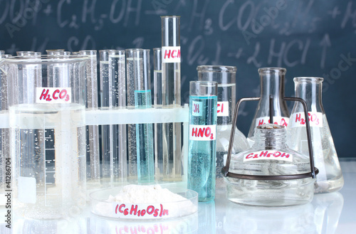 Test-tubes with various acids and other chemicals photo