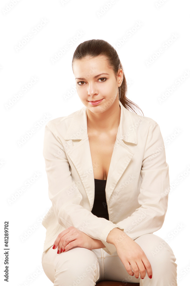 A pensive young woman sitting, isolated on white background A pensive young woman sitting, isolated on white background