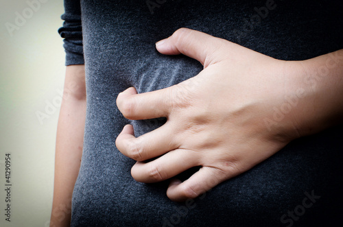 Woman Suffering From Abdominal Pain.
