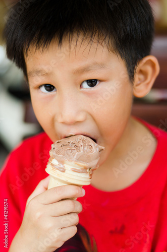 Asian boy enjoy his chocolate icecream