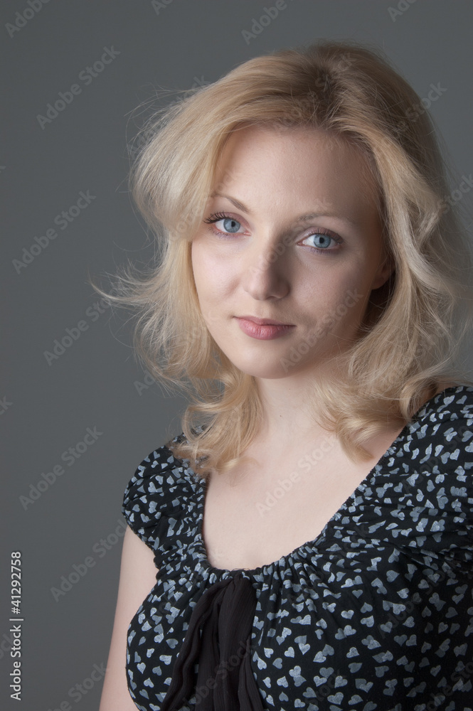 Young beautiful blonde woman in black dress with hearts close- Young beautiful blonde woman in black dress with hearts close-