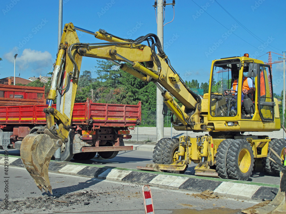 roadworks with a scraper to work in the middle of the road roadworks with a scraper to work in the middle of the road