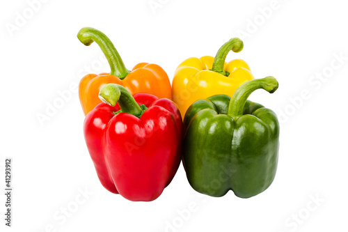 Fresh bell peppers all colors isolated on white background