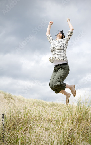 woman jumping for joy photo