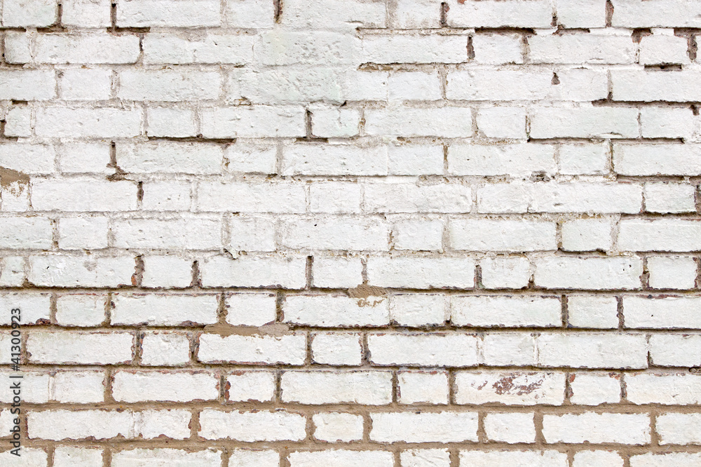 Old weathered brick wall white paint close up. Old weathered brick wall white paint close up.