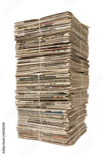 Towering stack of newspapers for recycling