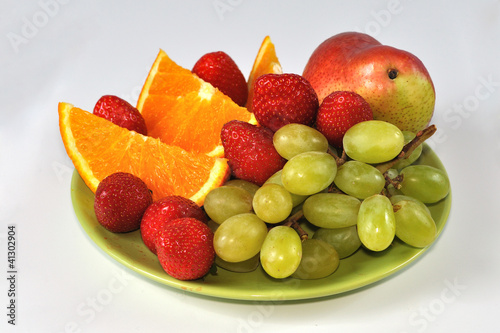 Isolated mix of fruits on plate