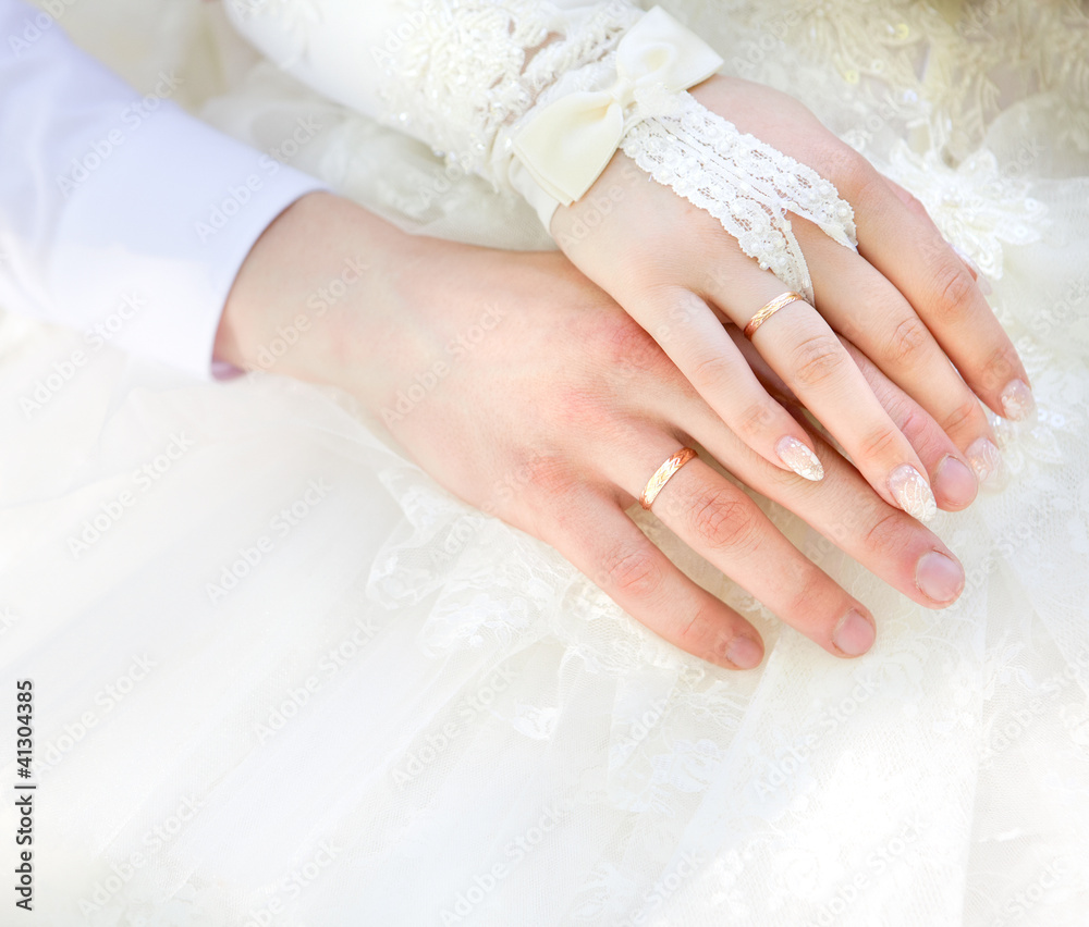 Hands of the groom and the bride with wedding rings Hands of the groom and the bride with wedding rings