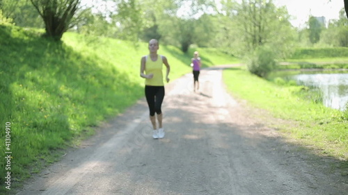 Wallpaper Mural Young woman taking breath during jogging Torontodigital.ca
