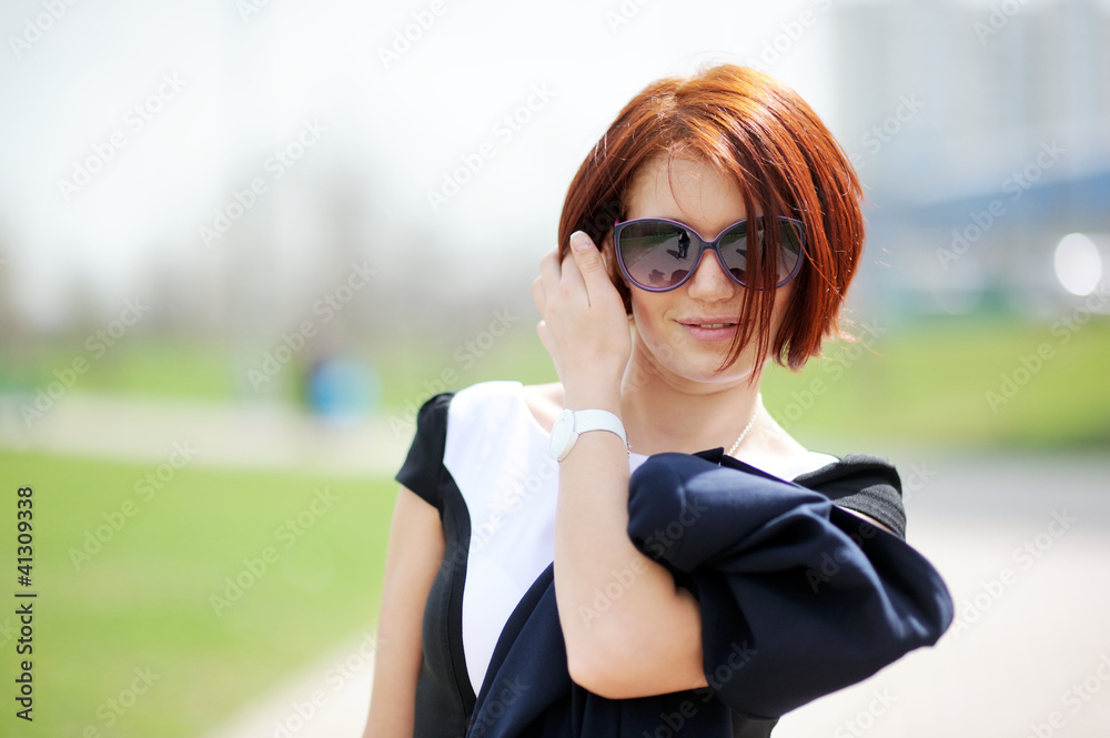 Outdoor portrait of beautiful woman with red hair Outdoor portrait of beautiful woman with red hair