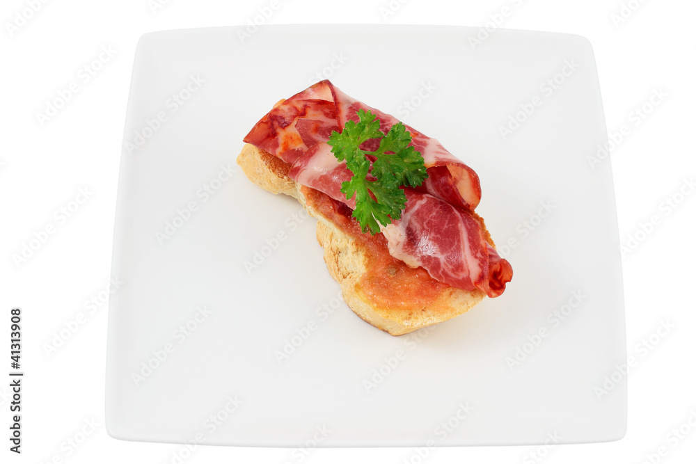 Slice of bread with spine and tomato Slice of bread with spine and tomato