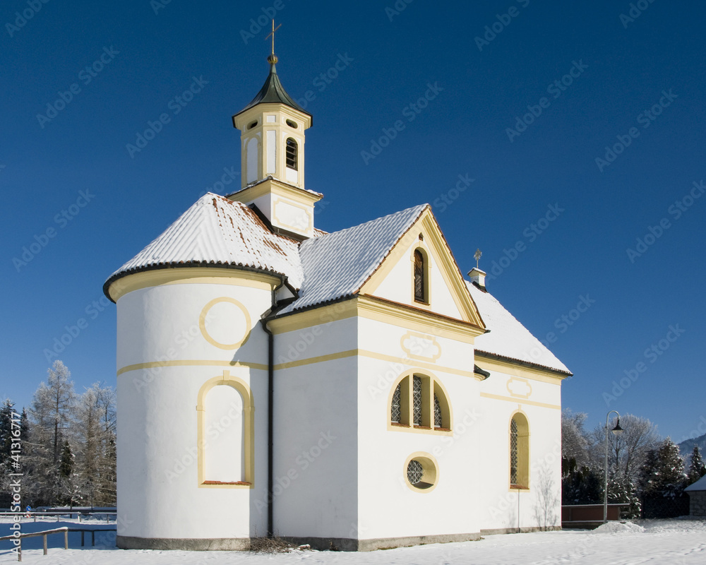 small church or chapel at wonderful winter day with blue sky