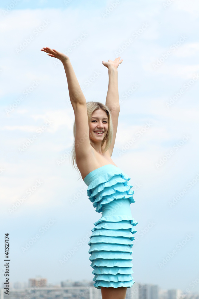 Young blond woman in sexy dress on background of the sky Young blond woman in sexy dress on background of the sky