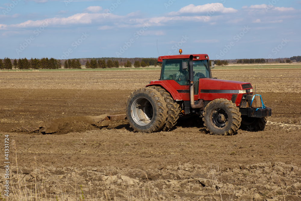 Agricultural landscape. tractor plowing the fields Agricultural landscape. tractor plowing the fields