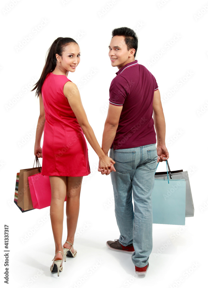 attractive happy couple carrying shopping bag attractive happy couple carrying shopping bag