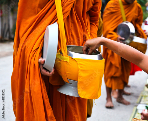 Offer food to monk on early morning