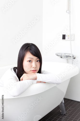 attractive asian woman in bathroom