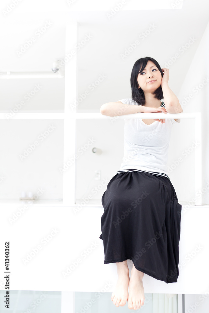 attractive asian woman relaxing in the room attractive asian woman relaxing in the room