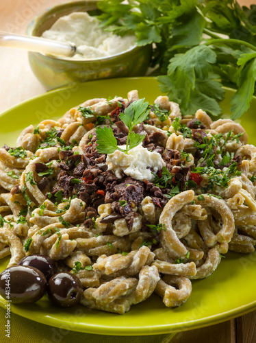 pasta casarecci with ricotta and black olive, heallthy food photo