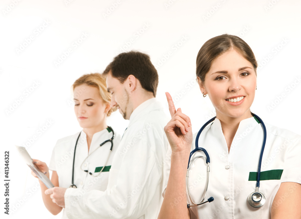 A team of young Caucasian doctors in white clothes A team of young Caucasian doctors in white clothes