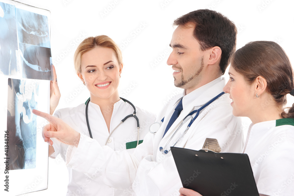 A team of young Caucasian doctors in white clothes A team of young Caucasian doctors in white clothes