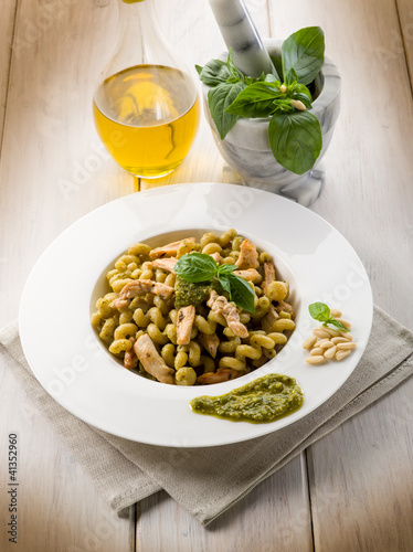 pasta with pesto sauce and chicken breast, healthy food