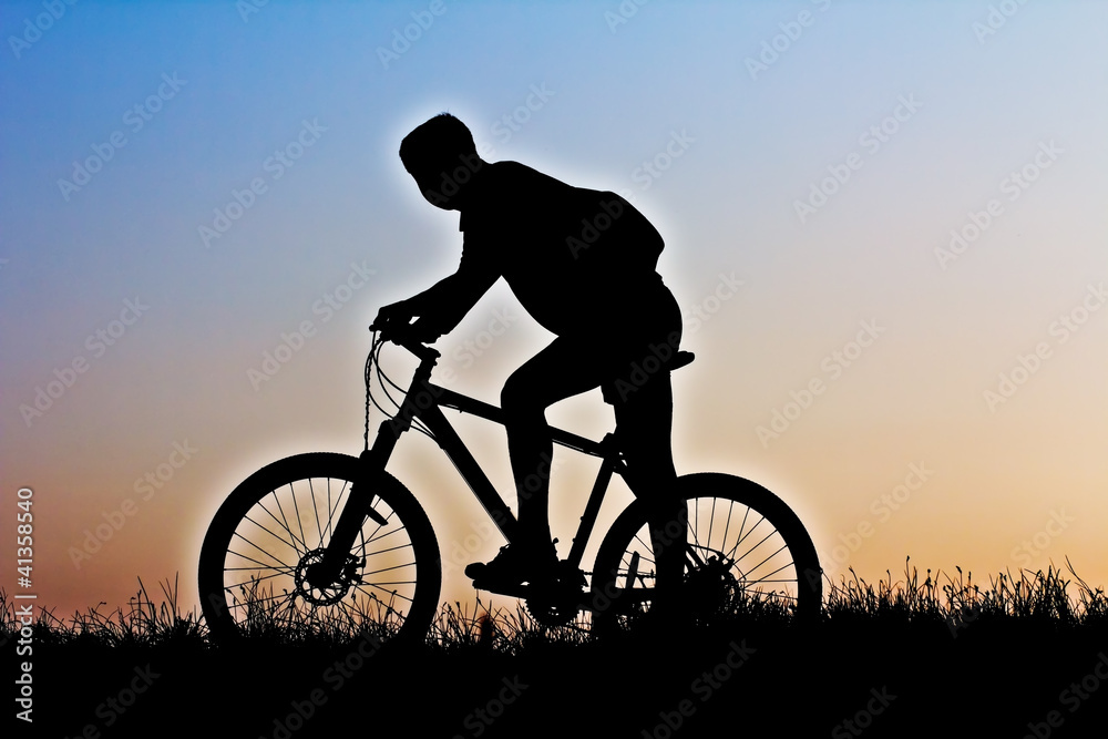 A silhouette of a cyclist A silhouette of a cyclist