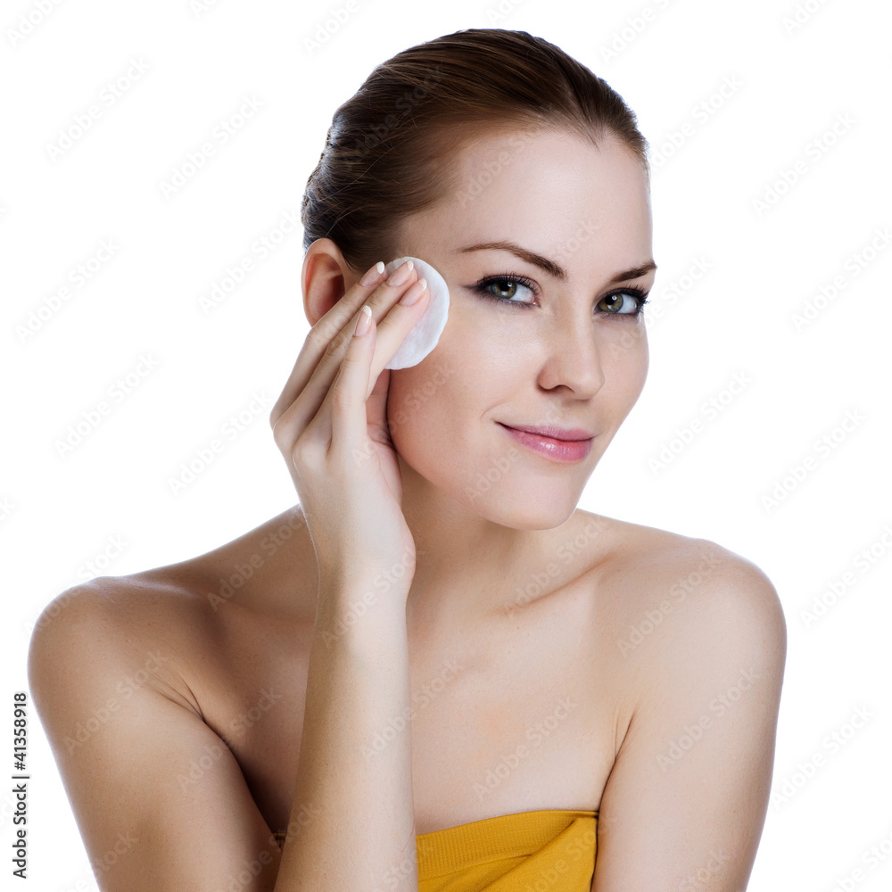 Close-up face of beauty young woman applying face foundation