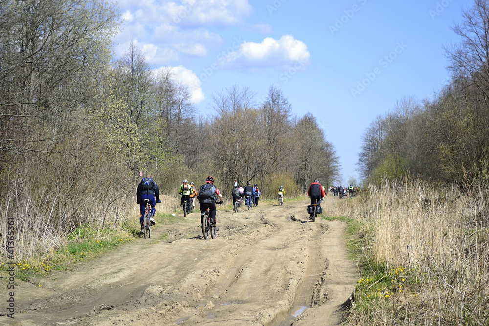 Cyclists riding on rural road