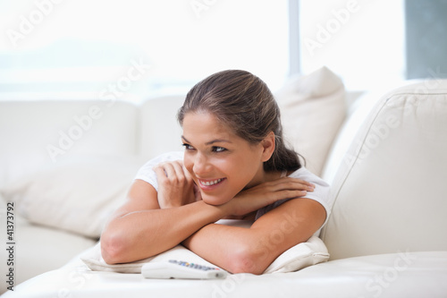 Free Download Women lying on a sofa while looking away - GFXLoad