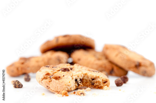 Half-eaten cookie in front of a stack of cookies