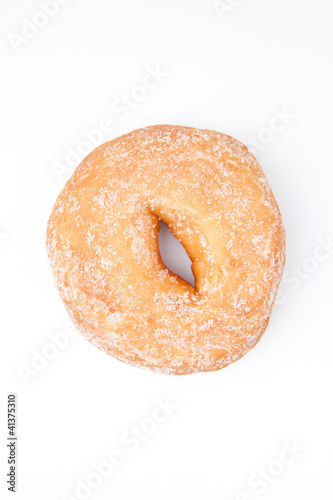 Extreme close up of a doughnut with icing sugar