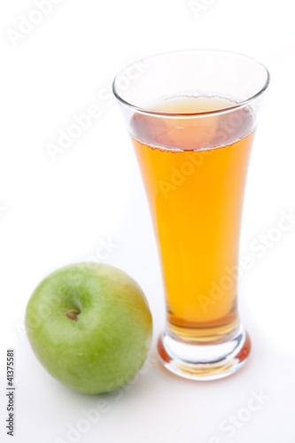 Apple place near a glass of apple juice