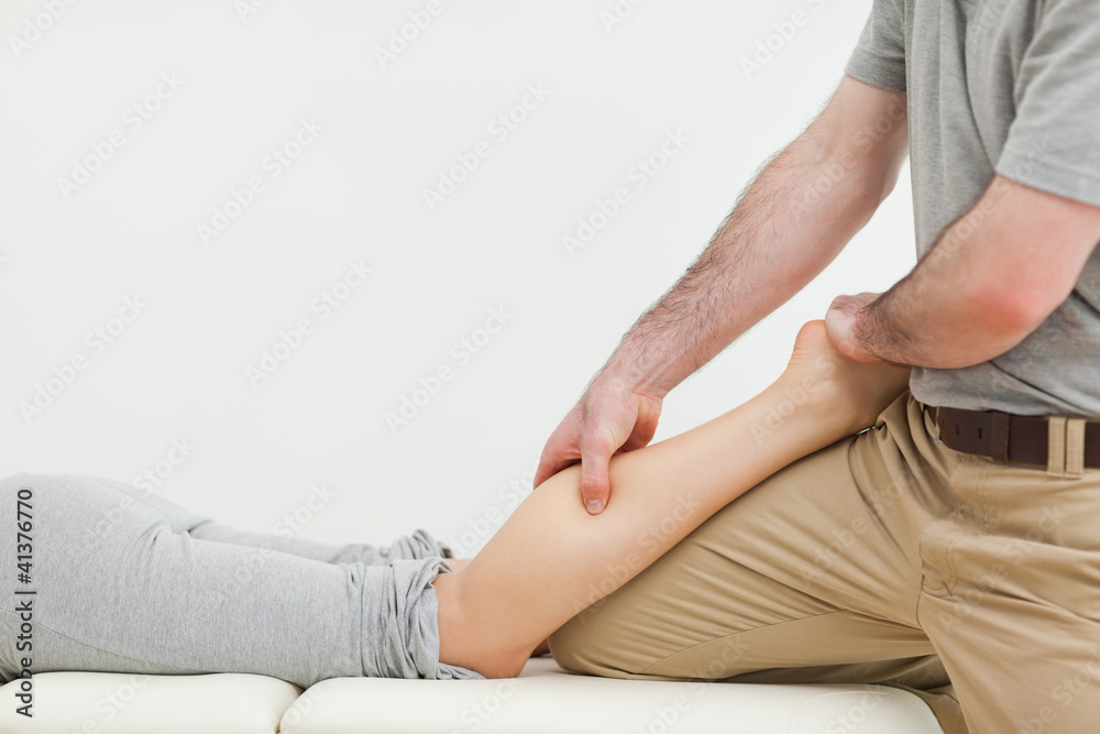 Close-up of a woman lying while being massaged