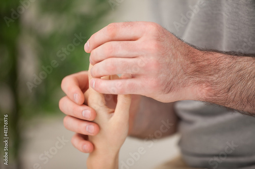 Hand of a patient being massaged