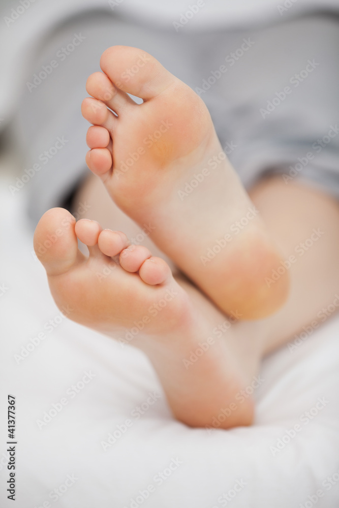 Close-up of the feet of a woman who is lying