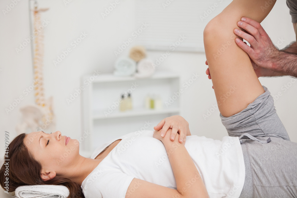 Fototapeta premium Peaceful patient being stretched by a doctor
