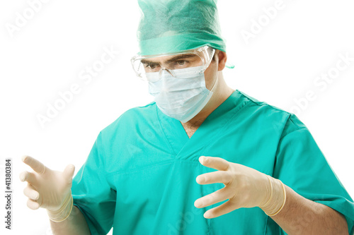 Male surgeon wearing a mask and gloves