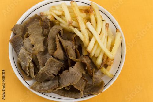 Donner Meat & Chips on a yellow / orange background