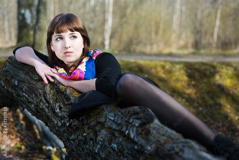 Beautiful woman lying on the tree Beautiful woman lying on the tree