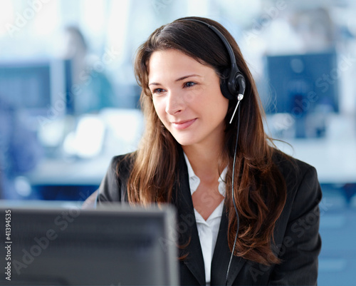 Woman with headset in the office