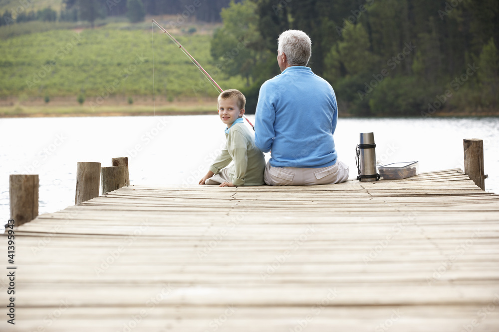 Senior man fishing with grandson Senior man fishing with grandson