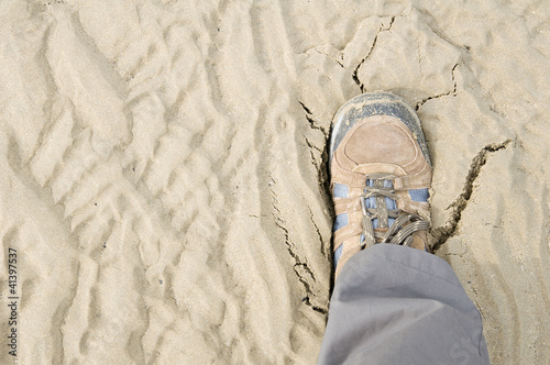 boots cracking sand photo