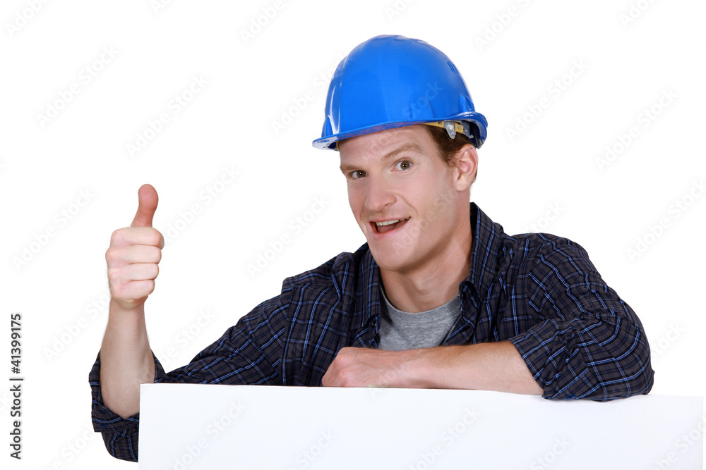 Builder with his thumb up Builder with his thumb up
