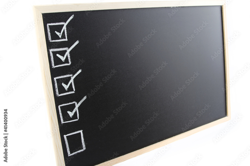 Fototapeta premium Ticks in checkbox on blackboard
