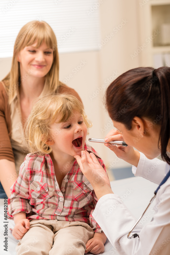 Pediatrician examine child throat look with light Pediatrician examine child throat look with light