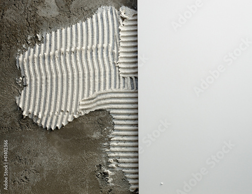 Fotografi construction notched trowel mortar and tiles