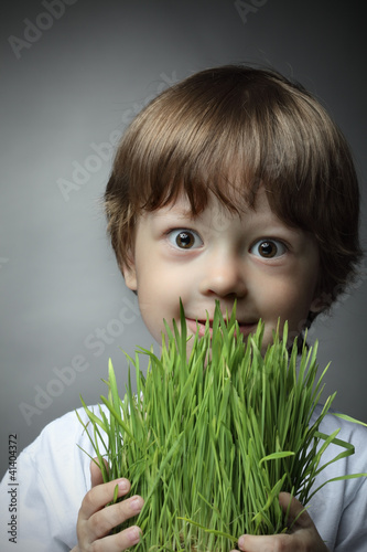 boy with grass, studio shot